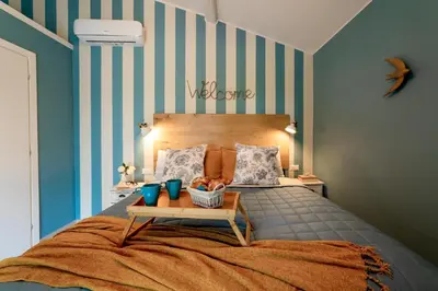 Letto o letti in una camera di Mansarda Chic con Parcheggio Privato by TuscanyWeGo