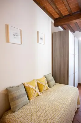 Letto o letti in una camera di YOUR APARTMENT IN FLORENCE