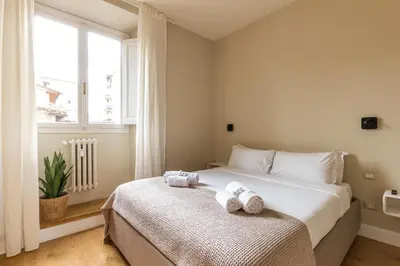 Letto o letti in una camera di Lungarno marvelous apartment with private parking