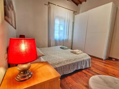 Letto o letti in una camera di Villa Castaldi Firenze vicina al centro