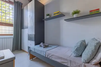 Letto o letti in una camera di Colonica San Cresci alle porte di Firenze 6 pax free parking