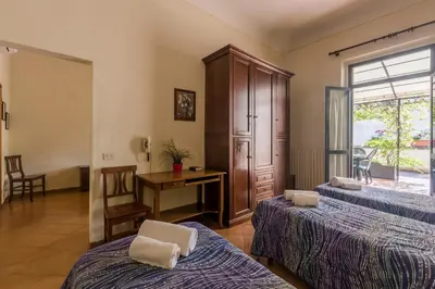 Letto o letti in una camera di Foresteria Valdese di Firenze