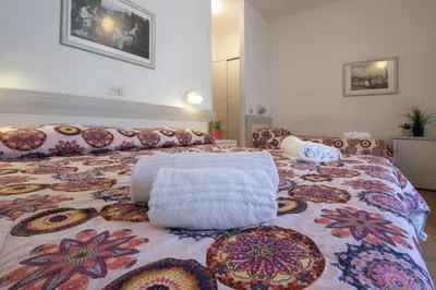 Letto o letti in una camera di Foresteria Valdese di Firenze