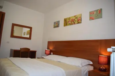 Letto o letti in una camera di Hotel Dalmazia