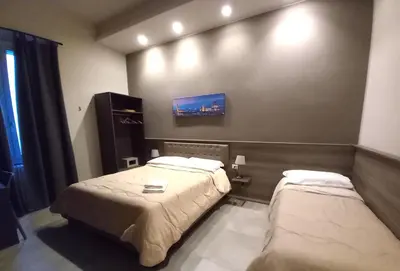 Letto o letti in una camera di La Corte di Firenze Bed and Breakfast