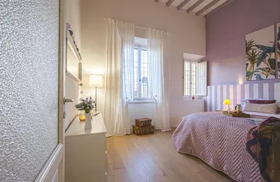 Letto o letti in una camera di Fuori le Mura di San Frediano - Flo Apartments