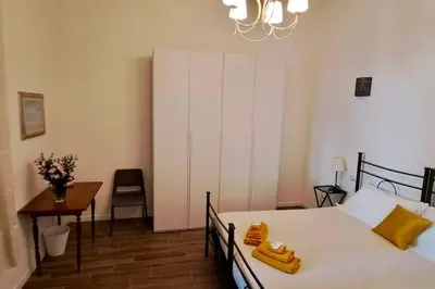 Letto o letti in una camera di Le case di Cate e Max - Sole
