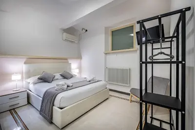 Letto o letti in una camera di YID Agnolo three bedroom apartment in Florence