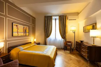 Letto o letti in una camera di Ariosto Charme