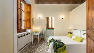 Letto o letti in una camera di VILLA TREGGIAIA 12&2, Emma Villas
