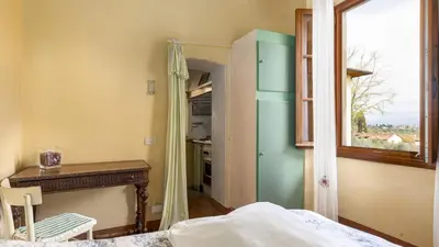 Letto o letti in una camera di VILLA TREGGIAIA 12&2, Emma Villas