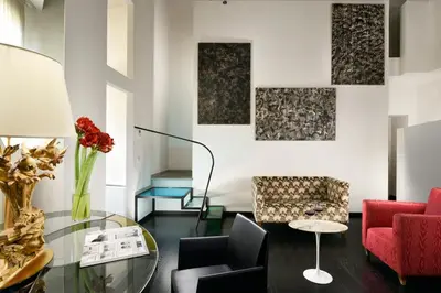 Area soggiorno di Leone Blu Suites | UNA Esperienze