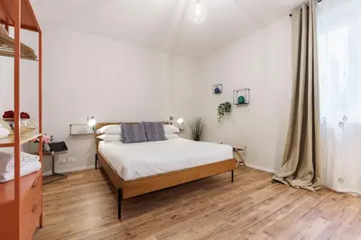 Letto o letti in una camera di Casa Lù - Milù Holidays Firenze