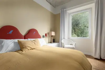 Letto o letti in una camera di EggPrint Florence