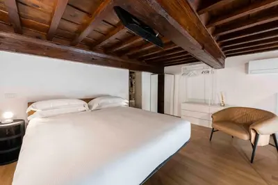 Letto o letti in una camera di appartamento palazzo bardi apartments n 1