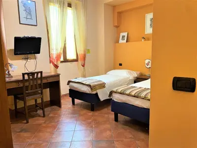 Letto o letti in una camera di Residence La Contessina