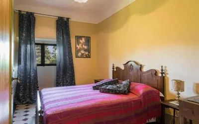 Letto o letti in una camera di Villa Del Mosaico