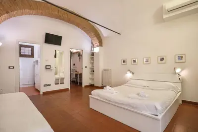 Letto o letti in una camera di L'Antica Concia - Sweet Dreams in Florence