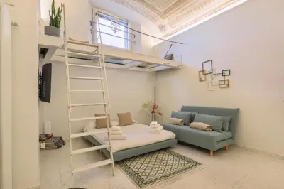 Letto o letti in una camera di WelcHome Cellini