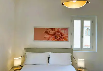 Letto o letti in una camera di White Iris Apartment
