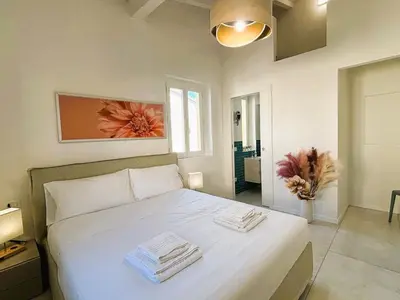 Letto o letti in una camera di White Iris Apartment