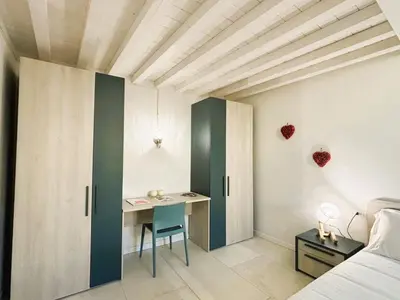 Letto o letti in una camera di White Iris Apartment