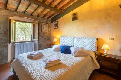Letto o letti in una camera di Casale Giaggiolo