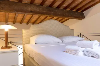 Letto o letti in una camera di Santa Croce Cozy Duplex