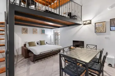 Letto o letti in una camera di B&B Essevu Loft Borgo Pinti