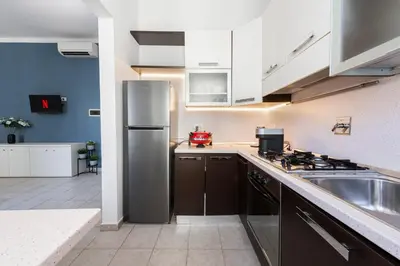 Cucina o angolo cottura di The Luxor Suites - Corsica