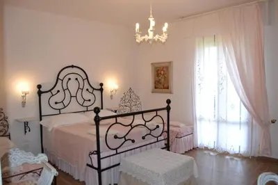 Letto o letti in una camera di B&B Villa Il Poggiolino