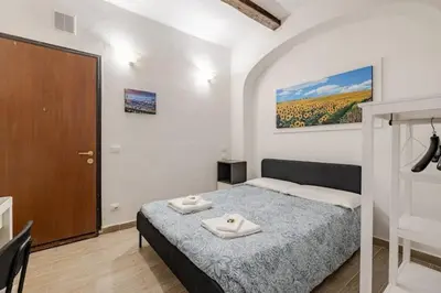 Letto o letti in una camera di Stanza Centrale a Firenze - Rodolfo