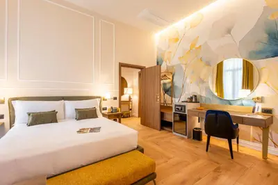 Letto o letti in una camera di Palazzo Don Minzoni