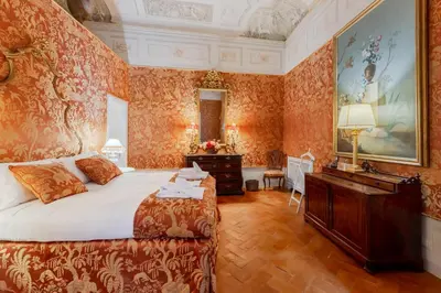 Letto o letti in una camera di Palazzo Bartolommei Dimora Storica Centralissima
