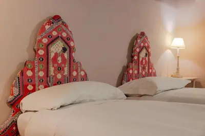 Letto o letti in una camera di Palazzo Bartolommei Dimora Storica Centralissima