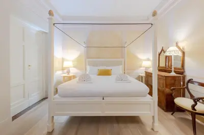 Letto o letti in una camera di Palazzo Bartolommei Dimora Storica Centralissima