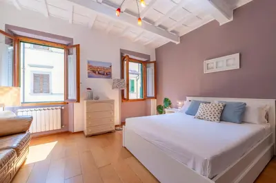 Letto o letti in una camera di San Frediano luxury Suite