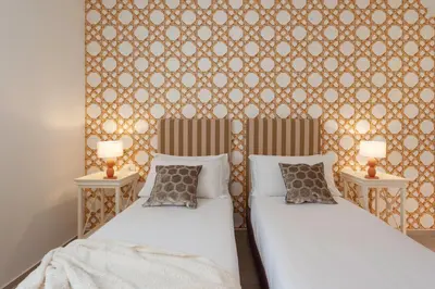 Letto o letti in una camera di La Corticina - Rooms & Suite - Firenze