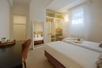Letto o letti in una camera di La Corticina - Rooms & Suite - Firenze