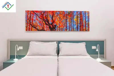 Letto o letti in una camera di Loggia Del Mazzei by TuscanyWeGo