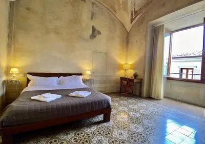 Letto o letti in una camera di Studio Bargello