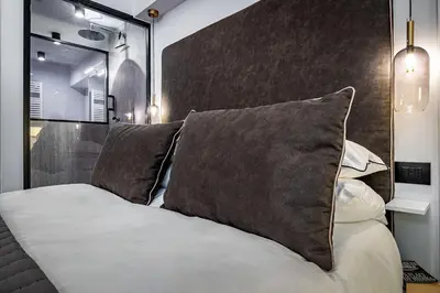 Letto o letti in una camera di Suite Nobellina Florence