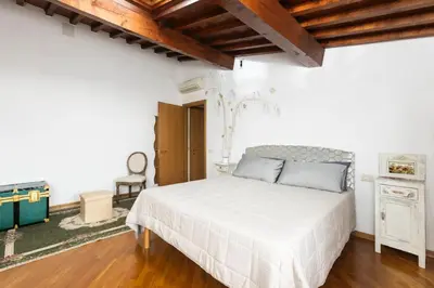 Letto o letti in una camera di Fabio's Rustic Flat