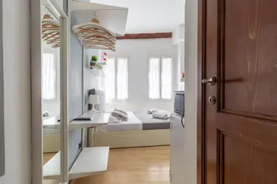 Letto o letti in una camera di Beatrice Suite Apartment