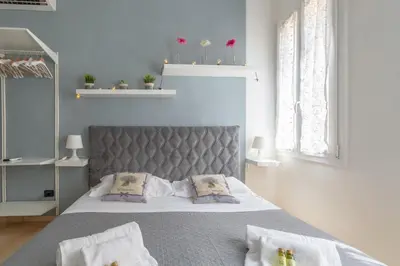 Letto o letti in una camera di Beatrice Suite Apartment