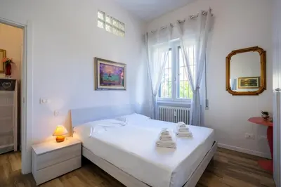 Letto o letti in una camera di Isolotto - Appartamento Affitto Firenze by Hôtea