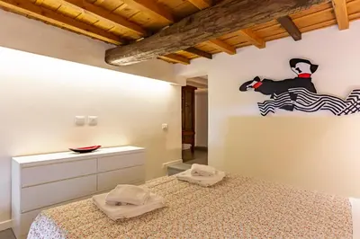 Letto o letti in una camera di GuestHost - Boutique House Porta Romana