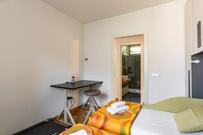 Letto o letti in una camera di GuestHost - Modern Apartment with Large Terrace