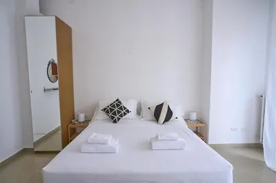 Letto o letti in una camera di SMN-Duomo Two-Room Apartment