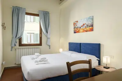 Letto o letti in una camera di Florence Slow-Life Flat in Oltrarno
